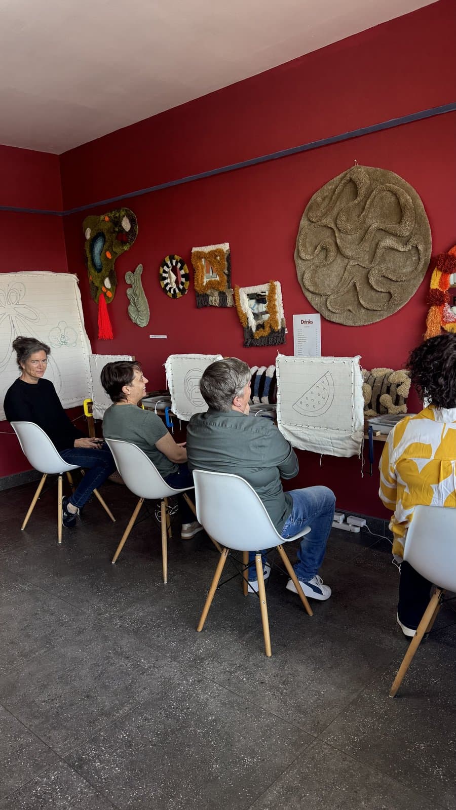 Wide view of a tufting class in session at the studio